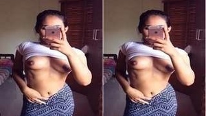 Attractive girl captures intimate photos of her breasts for partner