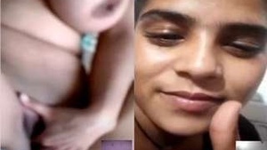 A beautiful woman reveals her breasts and masturbates with her hands