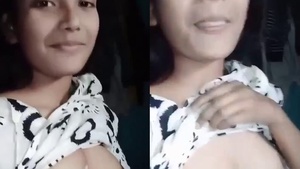 Young college girl flaunts her small boobs in a seductive video