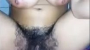 Bhabhi with big boobs and hairy pussy gets naughty on camera