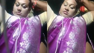 Watch a Desi aunty's big tits from the side in this steamy video