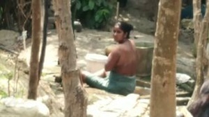 Caught on camera: Indian aunt bathes in the nude outdoors