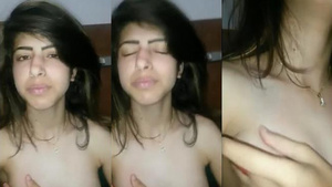 Adorable girl pleasures herself with her fingers in a selfie video