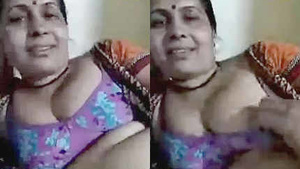 Mature Indian wife indulges in a steamy romance with her lover on webcam