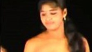 Watch a stunning South Indian woman perform a record-breaking dance in this steamy video