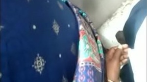 Desi aunty gives a public blowjob in the back of a car