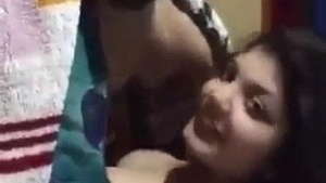 Getting intimate with my young wife under the blanket