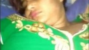 Husband pleasures his wife's pussy while she sleeps