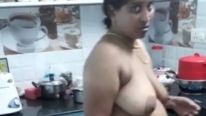 Big-boobed Chennai aunt cooks naked in sexy video