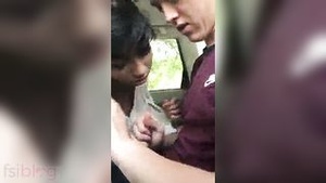 Indian girl gives her boyfriend a blowjob in the car