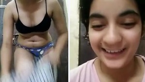 Watch a cute Indian girl pleasure herself with her fingers and moans