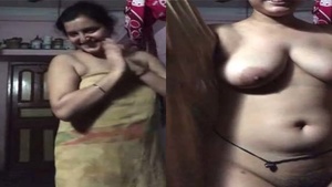 Hairy village aunty shows off her big boobs and hairy pussy
