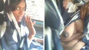 Desi babe flaunts her boobs and gives a blowjob in a car